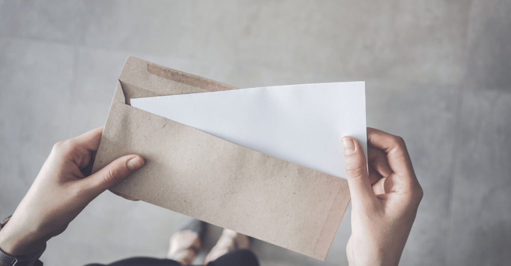 Woman opening letter