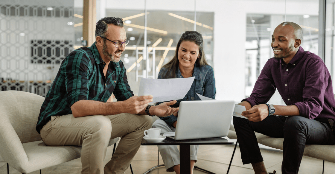 Three employees meet to discuss BPI in their customer service strategy.