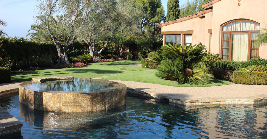 Landscaped backyard with artificial grass